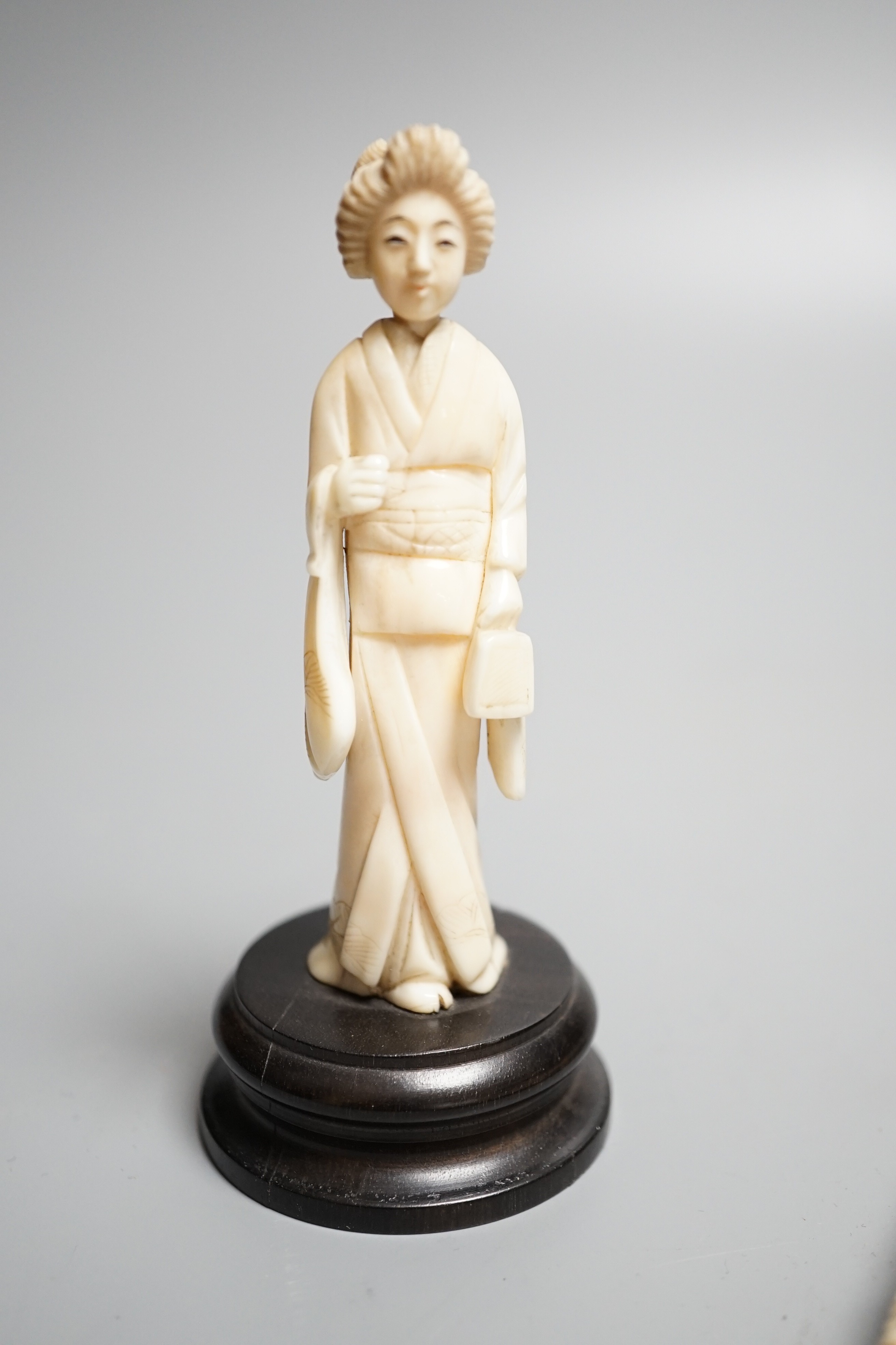 A Chinese export carved ivory bodkin case, 16cm, and a Japanese ivory figure of a geisha